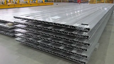 Extruded aluminum floor panels for metro cars